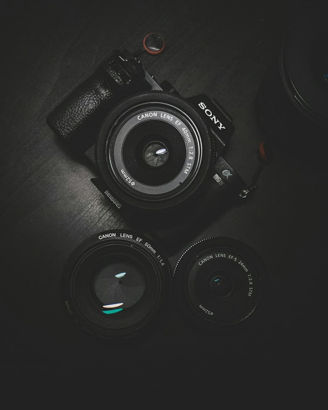 A camera and lenses arranged for a studio portrait
