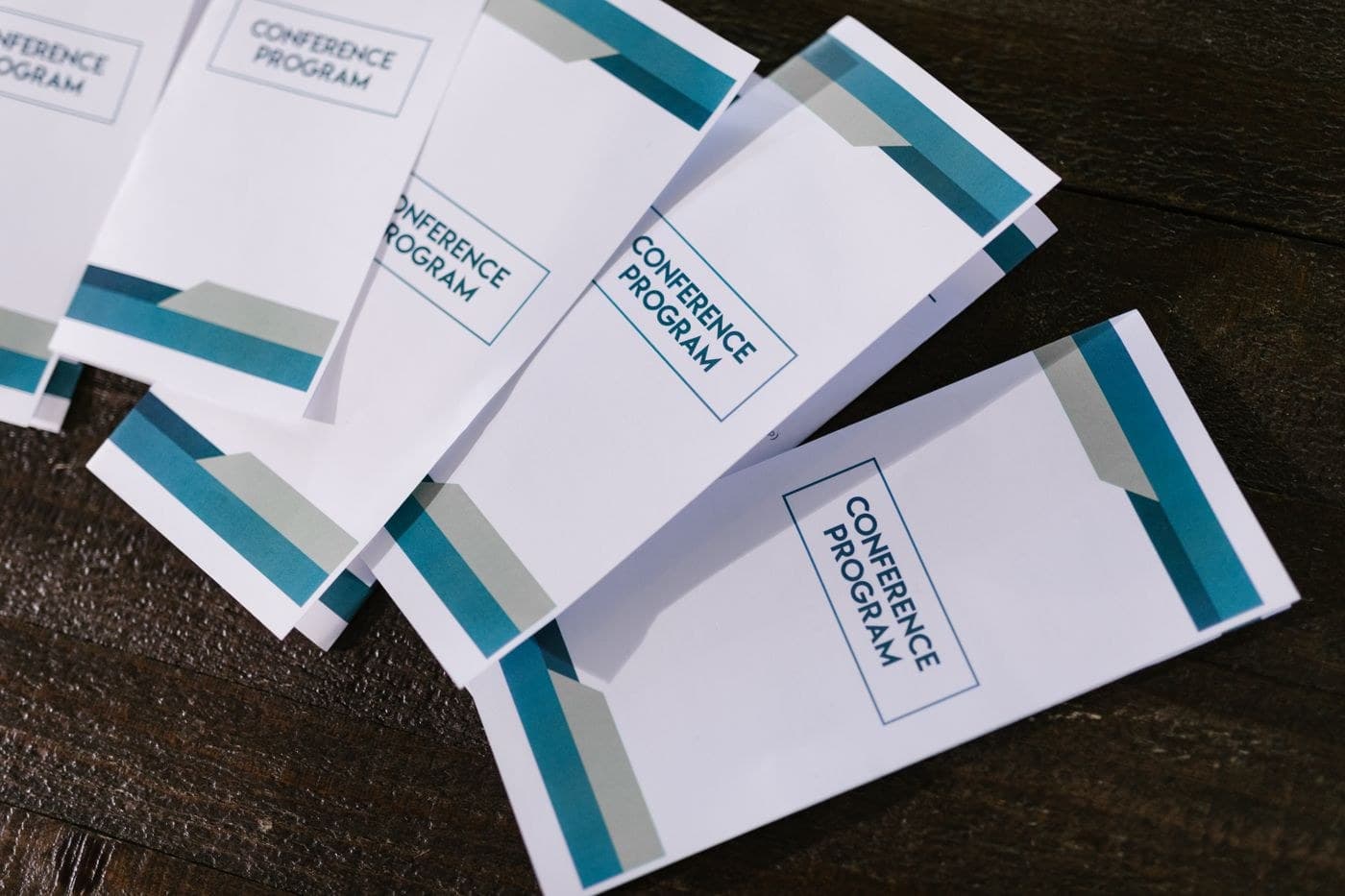 Printed event programme booklets laid on a table