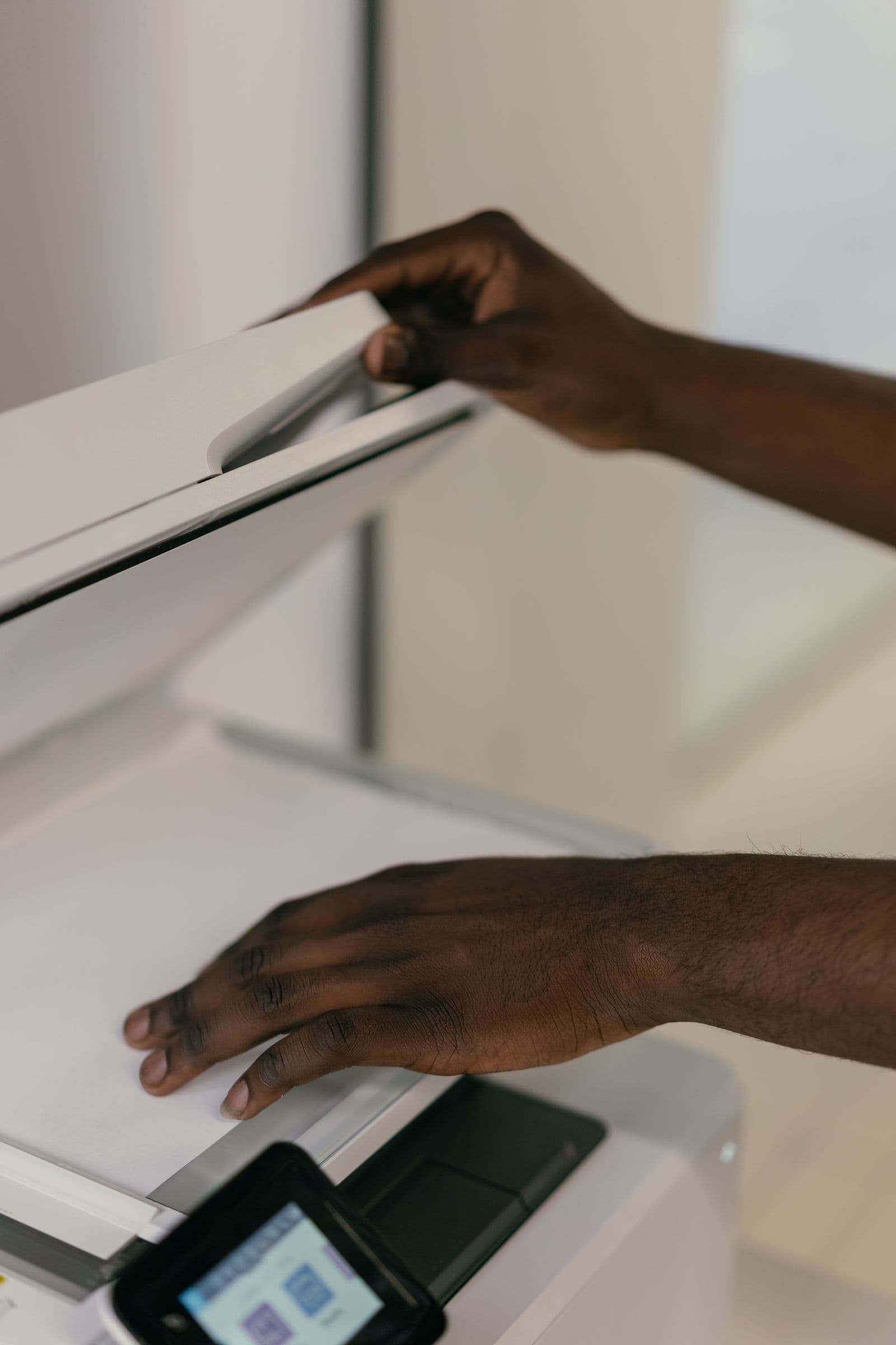 A page being placed on a flatbed scanner