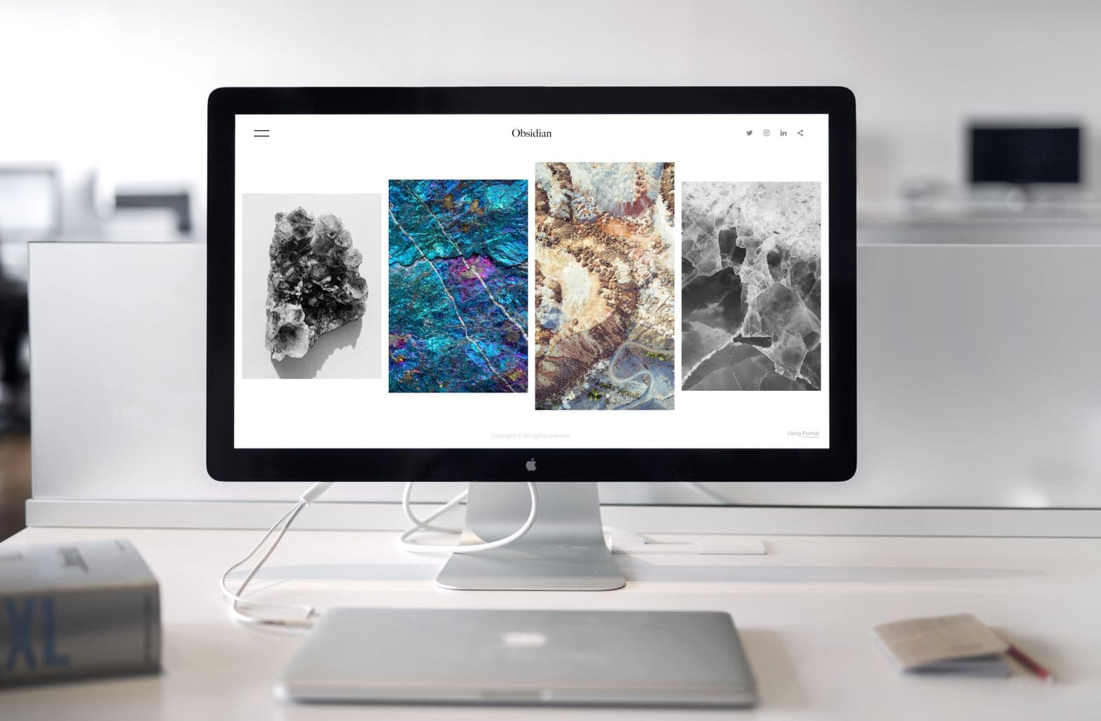 A website layout on a monitor in a design office