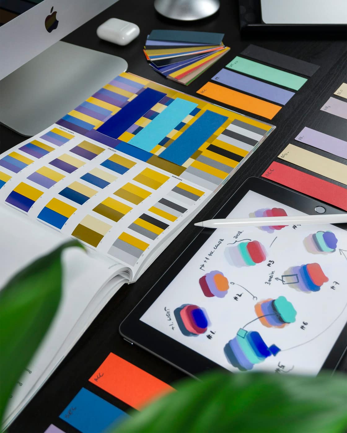 Design swatches and colour studies on a studio desk